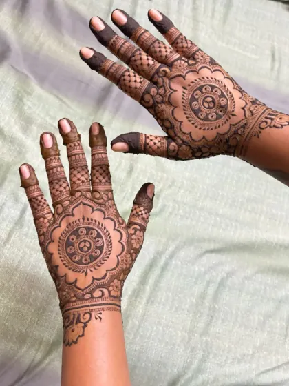 A stunning cutwork design with intricate mandalas and detailed finger patterns.