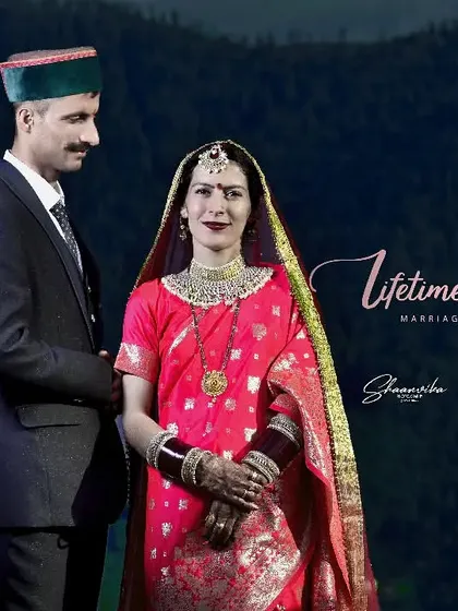 A beautiful portrait of a couple in traditional Himachali attire against a mountain backdrop. This image celebrates both their love and their cultural heritage.