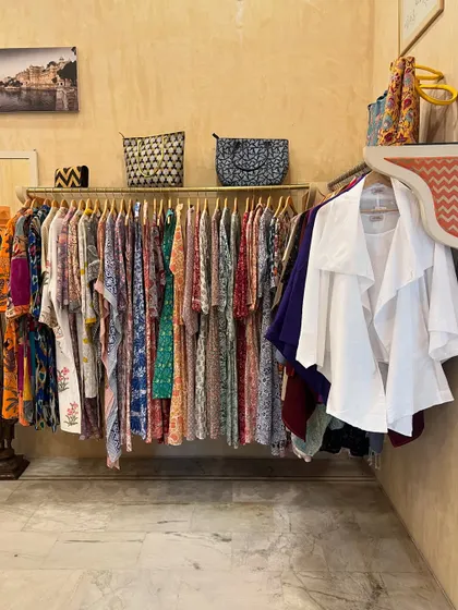 A rack of beautiful printed dresses and jackets in a Jaipur boutique. The city is known for its incredible textiles and contemporary Indian designer wear.
