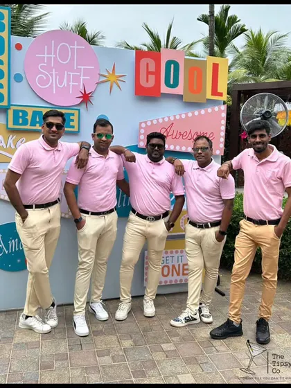 Our team in matching pink polo shirts for a cool, retro-themed event. We always dress the part to enhance the overall atmosphere of the party.