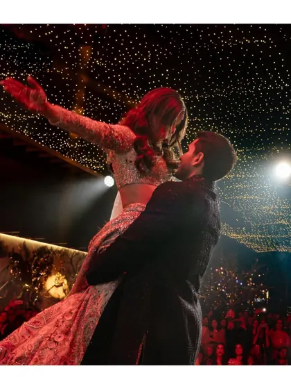 Alya and Shivaan soar during their first dance, under a sky of starry lights. This romantic and dynamic shot captures the magic of the moment.