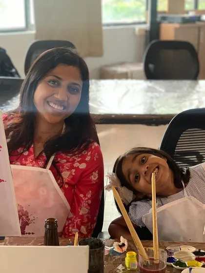 A mother and daughter bonding over a canvas at one of our workshops. Our events are a great family affair, perfect for creating memories together.