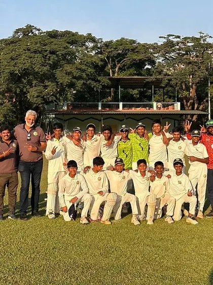 The joy of achievement. The U-14 team smiles for a group photo after a hard-fought tournament.