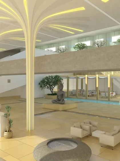 A conceptual render for a clubhouse lobby, featuring grand, tree-like pillars with integrated lighting that branch out across the ceiling. A central water body with a serene Buddha sculpture creates a tranquil and impressive entrance experience.