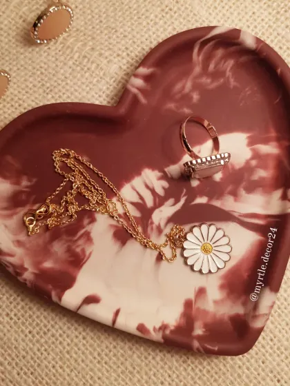 Another view of our 'Aurora' heart tray, showing how the white and deep red pigments swirl together to create a unique, dramatic marble pattern.