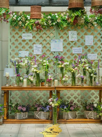 An interactive "Bloom Bar" where guests could create their own small bouquets as a party favor. This is a wonderful way to engage guests and add a personal, floral touch to the celebration.