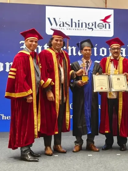 A group photograph from the International Conferment Award Ceremony. Our founder stands with other esteemed recipients and university faculty, marking a significant moment of international recognition for his work.