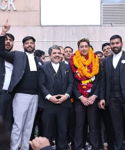 Celebrating with my colleagues outside the court complex. Their enthusiasm and dedication throughout the campaign for the bar association election were the foundation of our success.
