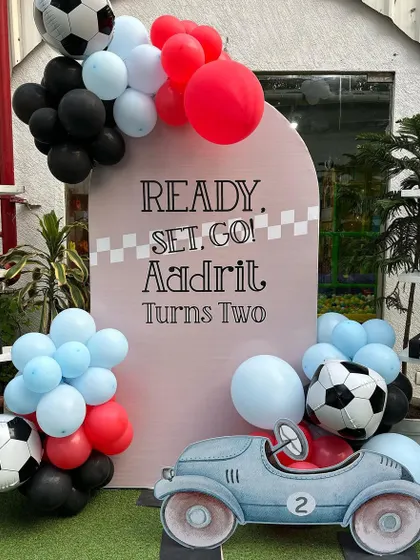 Ready, set, go! This race car-themed party was a high-speed hit, with a checkered flag finish line and sporty decor. We love creating a thrilling racetrack experience for our little speedsters.