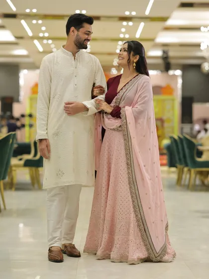 Another shot from our engagement, showing the coordinated outfits. His simple white kurta complements my detailed lehenga beautifully.