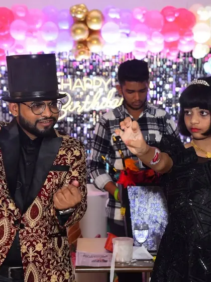 Teaching the birthday girl a magic pose. It's the small, personal interactions that make a party magic show truly special.