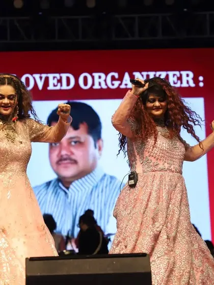 Dancing and singing on stage. Our shows are not just about singing; they are about performance and engaging with the audience.