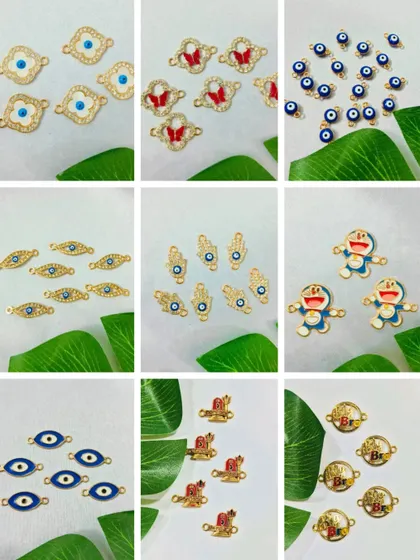 Add a trendy touch to your Rakhis with our collection of charms. This image shows various designs, including evil eye, hamsa hand, and even cute Doraemon charms.