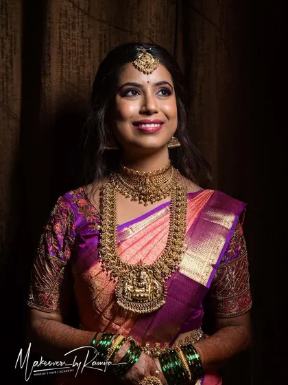 A happy, smiling portrait of the bride at her reception.