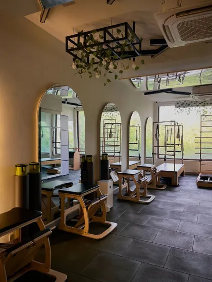 A look into our second studio space, featuring arched mirrors and modern decor. It’s all designed to inspire confidence and improve your posture.