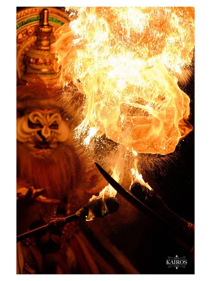 A breathtaking moment as a performer breathes fire. Capturing such a fast and dangerous moment requires precise timing and technical skill in low light.