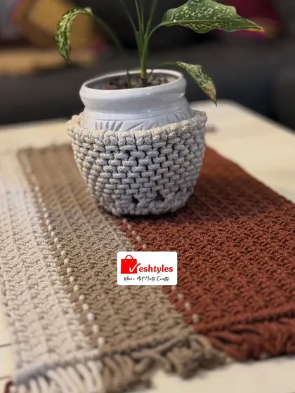A beautiful ombre table runner in shades of beige and brown, styled with a macrame-covered pot. A perfect combination for your center table.