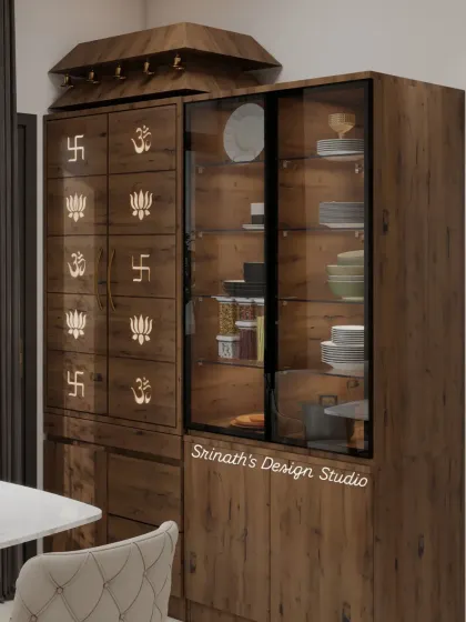 A closer look at the custom-designed pooja and crockery unit, detailing the wooden finish and the sacred symbols (Om, Swastika, Lotus) carved into the doors.