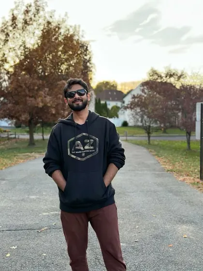 A casual look in a hoodie during autumn in New Jersey, USA. This photo is perfect for seasonal apparel campaigns, particularly for fall or winter collections.