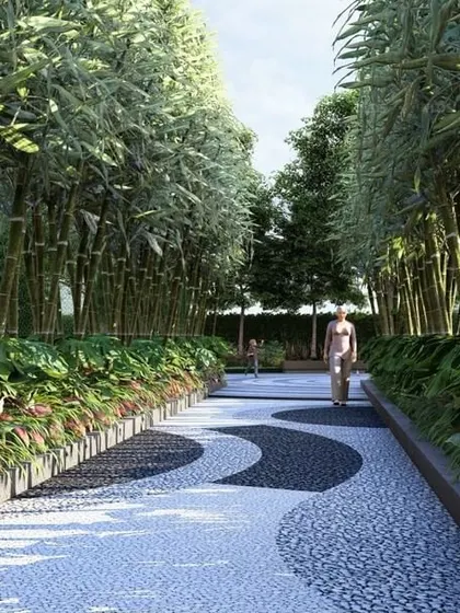 A serene walking path lined with tall bamboo and featuring a flowing yin-yang pattern in the pavement, designed to create a meditative and immersive journey.
