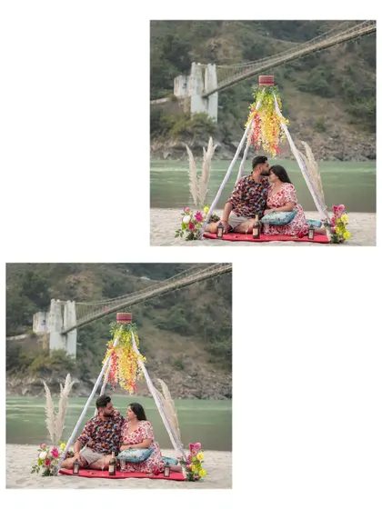 The couple enjoying their romantic picnic setup with the iconic Rishikesh bridge visible in the background.