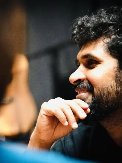 A candid shot of one of our actors, capturing his thoughtful expression. Each member of our ensemble brings their own personality and perspective to our collaborative work.