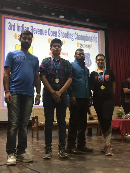 My students on stage after winning medals at the 3rd Indian Revenue Open Shooting Championship in 2019.