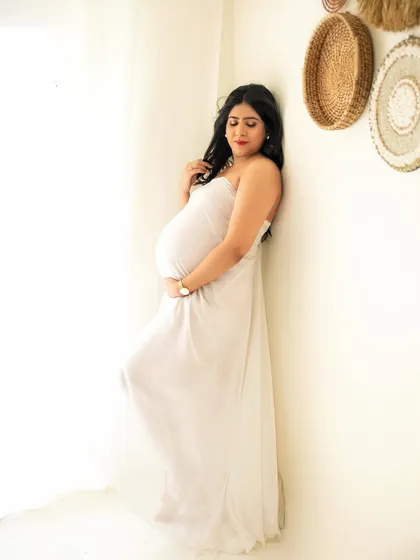 Draped in soft, sheer fabric, this mumma-to-be looks absolutely serene. I use simple props like fabrics to add a touch of elegance and softness to my studio maternity sessions.