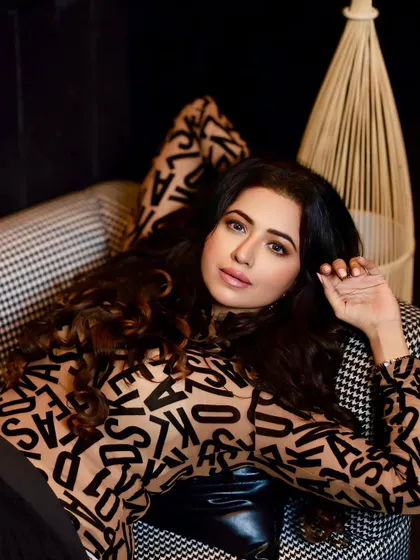 A close-up beauty shot of Ridhima Tiwari. This highlights the soft glam makeup, with a focus on beautifully blended eyeshadow and a neutral lip.