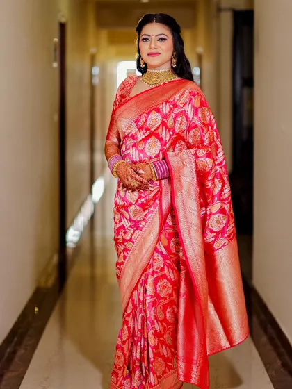 This bride wore a beautiful pink silk saree for her wedding. The makeup was kept soft and elegant to match the humidity of July, and it stayed flawless.