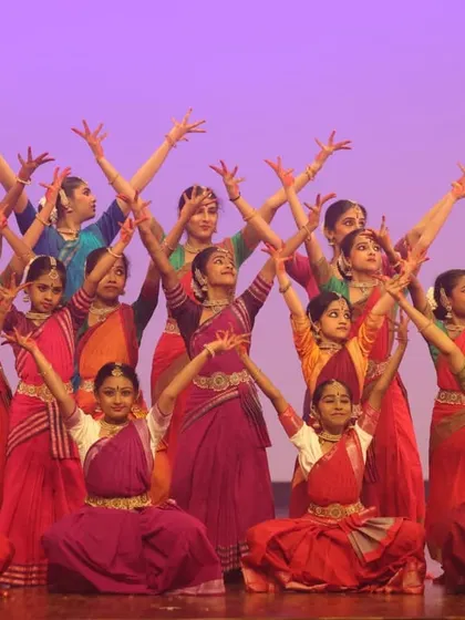 A vibrant group of our younger students performing a coordinated Bharatanatyam piece at SparkLights 2024. This moment captures the energy and dedication of over 120 performers who are part of our annual showcase.