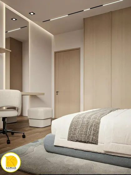 A bedroom with a light wood theme, featuring a built-in study desk and floor-to-ceiling wardrobes.