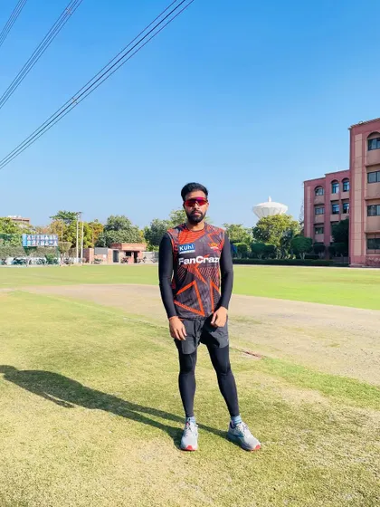 Facing the camera on the training ground. It's about being present, focused, and ready to lead the team through their conditioning work.