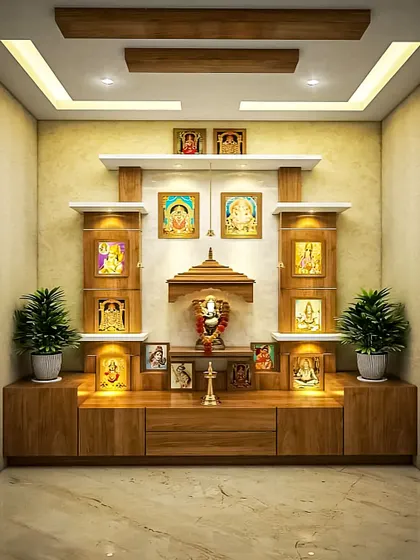 This pooja unit is built into a niche and features multiple levels of shelving for displaying various idols and photos. The warm wood and soft lighting make it a very serene corner.