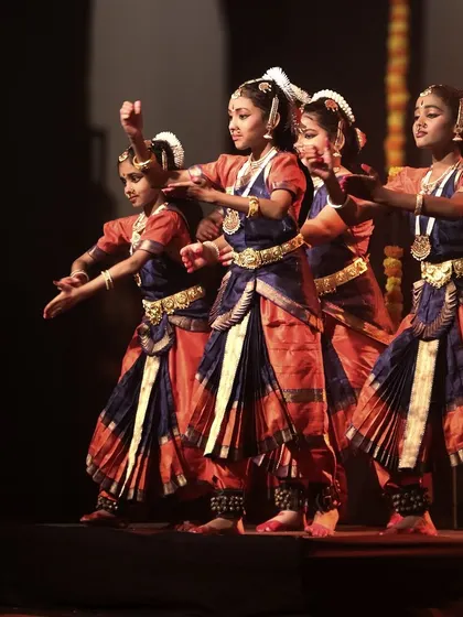 The precision in the dancers' movements, a hallmark of their training and dedication.