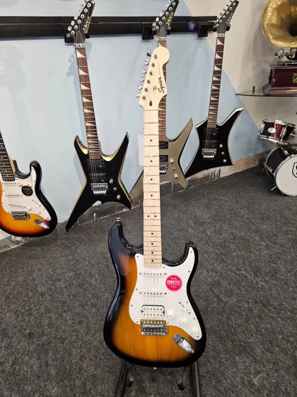 The Fender FSR Stratocaster HSS displayed among other electric guitars. This full shot shows its place in our collection, representing a perfect blend of traditional style and modern performance.