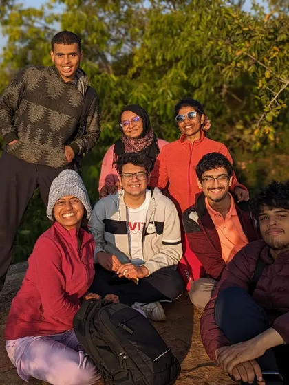 A group of friends posing for a photo during the Skandagiri trek.