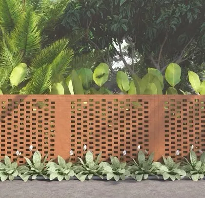 A terracotta jali (perforated screen) wall provides privacy while allowing for ventilation and light, adding a touch of traditional craftsmanship to the modern boundary design.