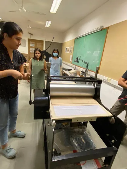 Students learning the mechanics of the printing press.