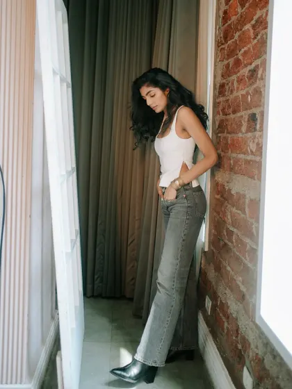 A full-length view of the natural makeup look for a model's portfolio. The makeup is designed to be versatile, working well for both commercial and lifestyle shots.