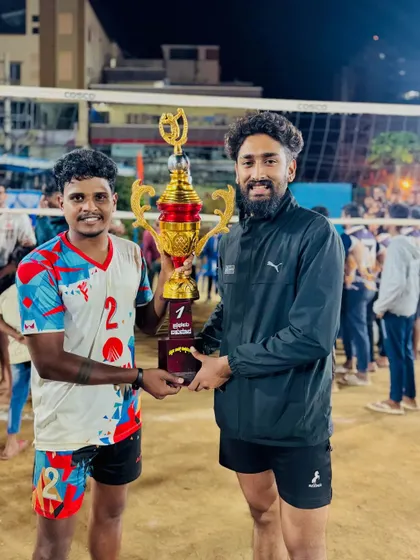 Sharing the victory with a teammate. Success in volleyball, just like in DJing, is about the collective energy and effort.