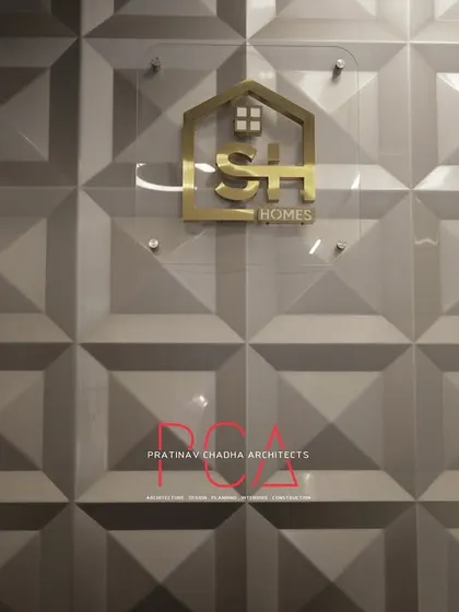 A close-up of the StyleIn Homes logo on a 3D geometric wall panel, an example of how I integrate client branding directly into the architectural design.