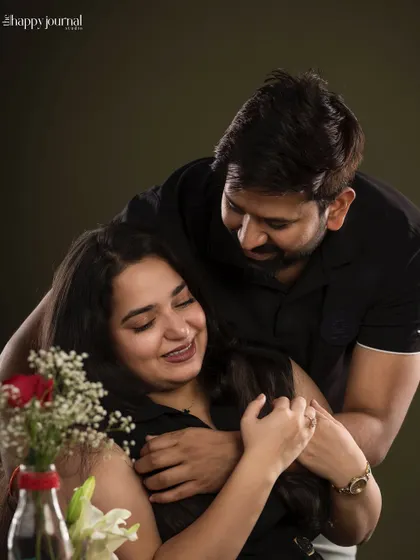 A warm embrace from behind. This photo captures a tender and affectionate moment between a couple, full of love and happiness.