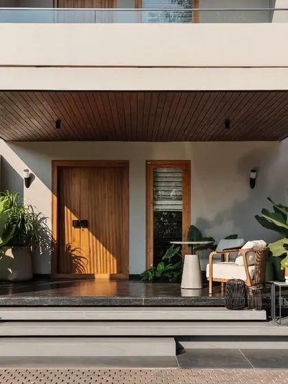 A straight-on view of the entrance, highlighting the clean lines of the porch and the warmth of the wood-paneled ceiling. This space sets the tone for the entire home's aesthetic of modern simplicity.