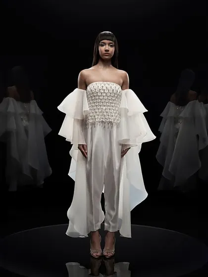 Our studio is equipped for high-end couture photography, where precise lighting control is key. For this Alpana Neeraj campaign, a pure black background and dramatic lighting were used to sculpt the form and highlight the intricate details of the garment.