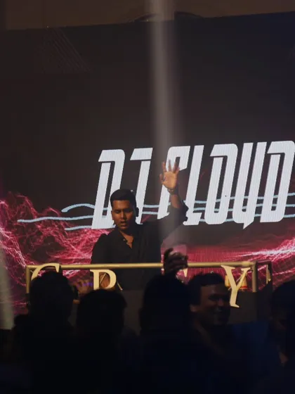 A view from the crowd's perspective, with my branding clearly visible on the large screen.