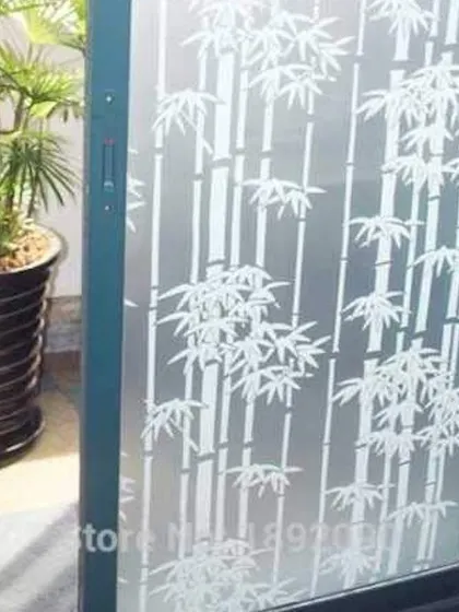 This frosted film features a classic white bamboo pattern. It's a calming, nature-inspired design that offers privacy for a sliding door leading to a balcony or patio.