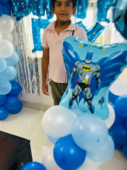A close-up of the Batman character balloon, which adds a fun and recognizable element for the kids.
