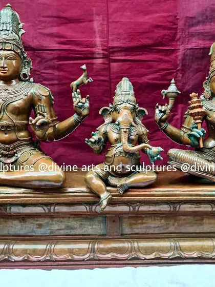 A full frontal view of the 24-inch Shiva Parivaram with its green oxide patina. This finish gives the sculpture the revered look of an ancient temple bronze that has been worshipped for centuries.