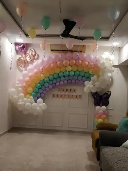 A wide shot of the living room with the pastel rainbow theme, demonstrating how the decor works within the space.